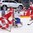 COLOGNE, GERMANY - MAY 15: Denmark's Patrick Russell #60 gets tripped up by Italy's Andreas Bernard #1 while Mathias Bau #50 looks on during preliminary round action at the 2017 IIHF Ice Hockey World Championship. (Photo by Andre Ringuette/HHOF-IIHF Images)

